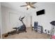 Cozy bedroom featuring neutral carpeting, ceiling fan, and a large closet at 5236 Krista Alethea St, North Las Vegas, NV 89031