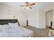Calm bedroom with a ceiling fan and neutral carpeting, creating a serene atmosphere at 5236 Krista Alethea St, North Las Vegas, NV 89031