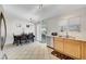 Eat-in kitchen featuring tile flooring, a modern light fixture, and stainless steel appliances at 5236 Krista Alethea St, North Las Vegas, NV 89031