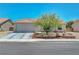 Charming single-story home featuring a well-manicured front yard and a two-car garage at 5236 Krista Alethea St, North Las Vegas, NV 89031