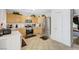 Well-lit kitchen with stainless steel appliances, tile flooring, and lots of counter space at 5236 Krista Alethea St, North Las Vegas, NV 89031