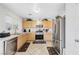 Functional kitchen with stainless steel appliances, ample counter space, and tile floors at 5236 Krista Alethea St, North Las Vegas, NV 89031