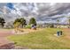 Well maintained community park featuring a playground, trees, walking path, and benches in a Gathering neighborhood at 5236 Krista Alethea St, North Las Vegas, NV 89031