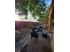 Inviting backyard patio featuring brick pavers, comfortable seating, and a hammock for relaxation at 5507 Gemini Bridges St, Las Vegas, NV 89130