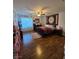 Comfortable bedroom with hardwood floors, ceiling fan, and lots of natural light at 5507 Gemini Bridges St, Las Vegas, NV 89130