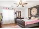 Comfortable bedroom with hardwood floors and a ceiling fan at 5507 Gemini Bridges St, Las Vegas, NV 89130