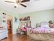 bedroom with desk, single bed, closet access and hardwood floors at 5507 Gemini Bridges St, Las Vegas, NV 89130