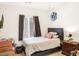 Bedroom featuring a single bed, with wooden floors and natural light at 5507 Gemini Bridges St, Las Vegas, NV 89130