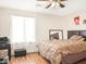 Bedroom featuring a queen sized bed, laminate flooring, and a window for natural light at 5507 Gemini Bridges St, Las Vegas, NV 89130