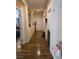 Well-lit hallway showcasing beautiful wood floors and decorative niches at 5507 Gemini Bridges St, Las Vegas, NV 89130