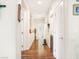 Bright hallway featuring hardwood floors, neutral walls, and recessed lighting leading to various rooms at 5507 Gemini Bridges St, Las Vegas, NV 89130