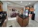 Spacious kitchen with island, stainless steel appliances, and dining area at 5507 Gemini Bridges St, Las Vegas, NV 89130