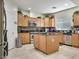 Spacious kitchen featuring stainless steel appliances, central island, and plenty of counter space at 5507 Gemini Bridges St, Las Vegas, NV 89130