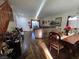 Spacious living room and dining area with hardwood floors and a staircase at 5507 Gemini Bridges St, Las Vegas, NV 89130