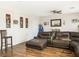 Casual living room features a comfortable brown leather sectional, ideal for relaxing and entertaining at 5507 Gemini Bridges St, Las Vegas, NV 89130