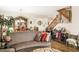 Comfortable living space with hardwood flooring, stairs, and stylish furnishings for a relaxing atmosphere at 5507 Gemini Bridges St, Las Vegas, NV 89130