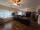 Comfortable living room with hardwood floors, large windows, and a cozy atmosphere at 5507 Gemini Bridges St, Las Vegas, NV 89130