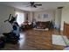 Bright living room with wood floors, ceiling fan, and comfortable seating at 5507 Gemini Bridges St, Las Vegas, NV 89130