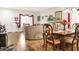 Bright and airy living space with hardwood floors, dining area, and large windows for ample natural light at 5507 Gemini Bridges St, Las Vegas, NV 89130