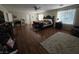 Large main bedroom features wood floors, a king-size bed, and a ceiling fan at 5507 Gemini Bridges St, Las Vegas, NV 89130