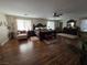 Expansive main bedroom with wood floors, natural light, and elegant furnishings at 5507 Gemini Bridges St, Las Vegas, NV 89130