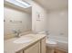 Bathroom showcasing well-lit mirror, granite counters, and standard white tub at 5713 Whiteridge Ave, Las Vegas, NV 89107