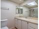 Bright bathroom with white vanity, stylish mirror, and glass-enclosed shower with updated fixtures at 5713 Whiteridge Ave, Las Vegas, NV 89107