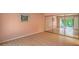 Spacious bedroom featuring sliding glass doors to an outdoor patio area at 5713 Whiteridge Ave, Las Vegas, NV 89107