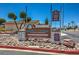 Welcoming sign for Ridgemount Townhomes, a private community with well-maintained landscaping at 5713 Whiteridge Ave, Las Vegas, NV 89107