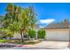 Charming single story home with desert landscaping, an attached garage, and a front gate at 5713 Whiteridge Ave, Las Vegas, NV 89107