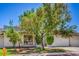 Charming single story home with desert landscaping, an attached garage, and a front gate at 5713 Whiteridge Ave, Las Vegas, NV 89107