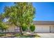 Charming single story home with desert landscaping, an attached garage, and a front gate at 5713 Whiteridge Ave, Las Vegas, NV 89107