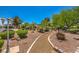 Beautifully landscaped walkway with mature trees and shrubbery, creating a peaceful atmosphere at 5713 Whiteridge Ave, Las Vegas, NV 89107