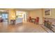 Open-concept living room with a fireplace and access to the kitchen and backyard at 5713 Whiteridge Ave, Las Vegas, NV 89107