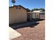 Back of the house with a covered patio and xeriscaping at 6196 W University Ave, Las Vegas, NV 89103