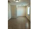 Bright bedroom with neutral walls, tile flooring, and a window at 6196 W University Ave, Las Vegas, NV 89103