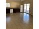 A large kitchen with tile flooring, lots of counterspace and a side-by-side fridge at 6196 W University Ave, Las Vegas, NV 89103