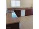 Kitchen showcasing tile flooring, granite countertops, and updated appliances at 6196 W University Ave, Las Vegas, NV 89103