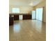A large kitchen with tile flooring, lots of counterspace and a side-by-side fridge at 6196 W University Ave, Las Vegas, NV 89103