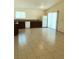 Bright kitchen featuring tile flooring, wood cabinets, and modern appliances at 6196 W University Ave, Las Vegas, NV 89103