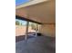 View of the covered patio and back yard with xeriscaping at 6196 W University Ave, Las Vegas, NV 89103
