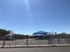 School playground with basketball court and canopy-covered play area at 6196 W University Ave, Las Vegas, NV 89103