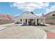 Spacious backyard featuring a covered patio area perfect for outdoor dining and entertaining at 628 Bay Bridge Dr, North Las Vegas, NV 89032