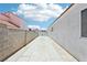 Long, concrete backyard space between houses at 628 Bay Bridge Dr, North Las Vegas, NV 89032