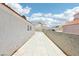 Wide backyard space with a view between houses at 628 Bay Bridge Dr, North Las Vegas, NV 89032