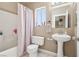 Bathroom with shower/tub, sink, and vanity mirror above the toilet at 628 Bay Bridge Dr, North Las Vegas, NV 89032
