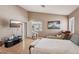 Bright and airy bedroom with a bed, chaise lounge, and a view of the outdoors at 628 Bay Bridge Dr, North Las Vegas, NV 89032