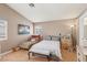 Bedroom includes a bed, a chaise lounge, and wood-look flooring at 628 Bay Bridge Dr, North Las Vegas, NV 89032