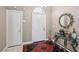 Inviting entryway featuring a colorful tiled floor, decorative mirror, and a white front door at 628 Bay Bridge Dr, North Las Vegas, NV 89032