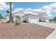 Charming single-story home with a well-manicured desert front yard and a two-car garage at 628 Bay Bridge Dr, North Las Vegas, NV 89032